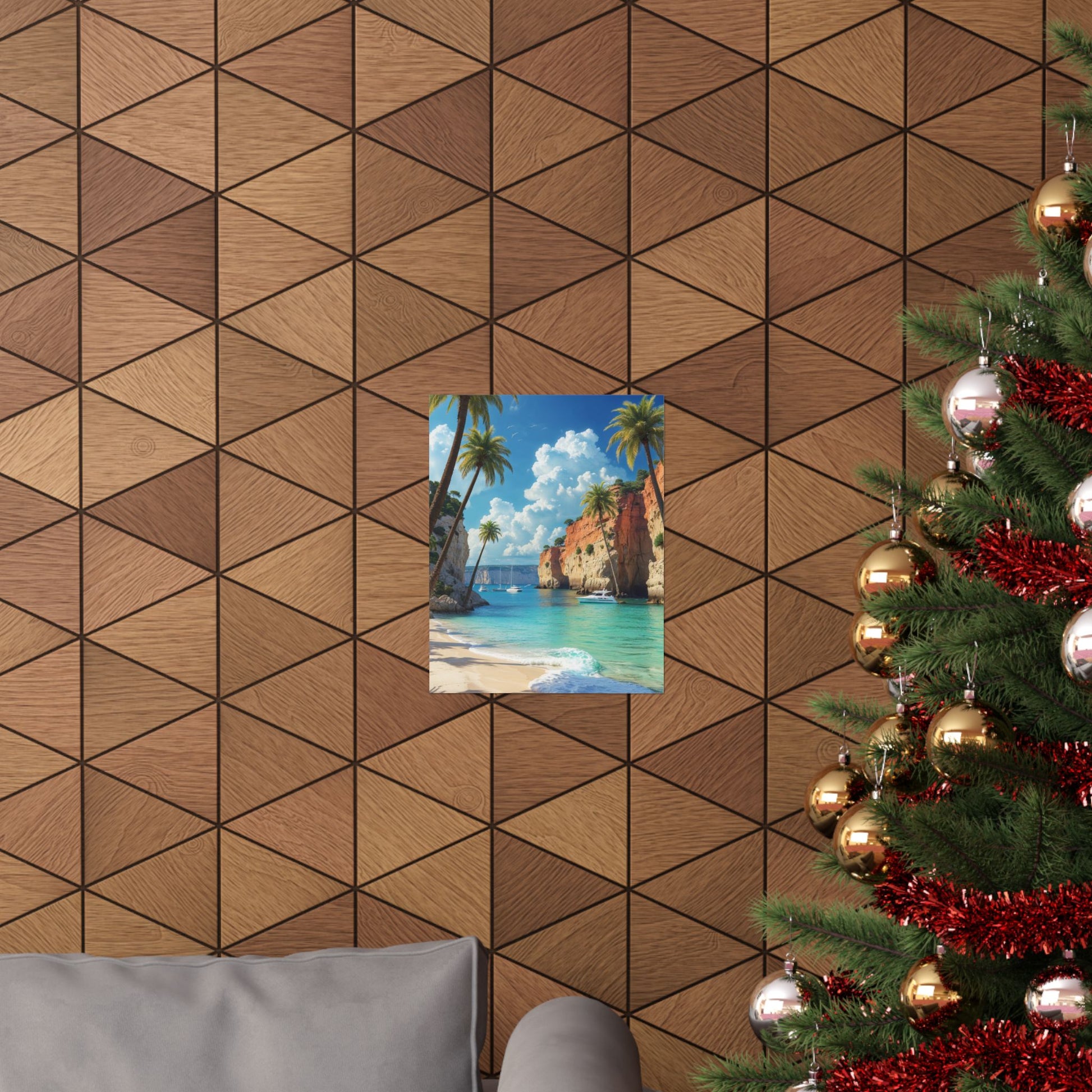 Coastal art print featuring a beach scene, displayed on a patterned wall with a Christmas tree nearby.